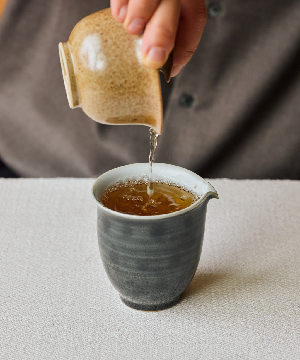 Shuixian Flower Fairy golden liquor with cacao shell and violet notes, Wuyi Mountain rock oolong