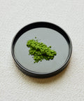 Matcha Yamekaze Japanese latte grade matcha powder in black ceramic bowl