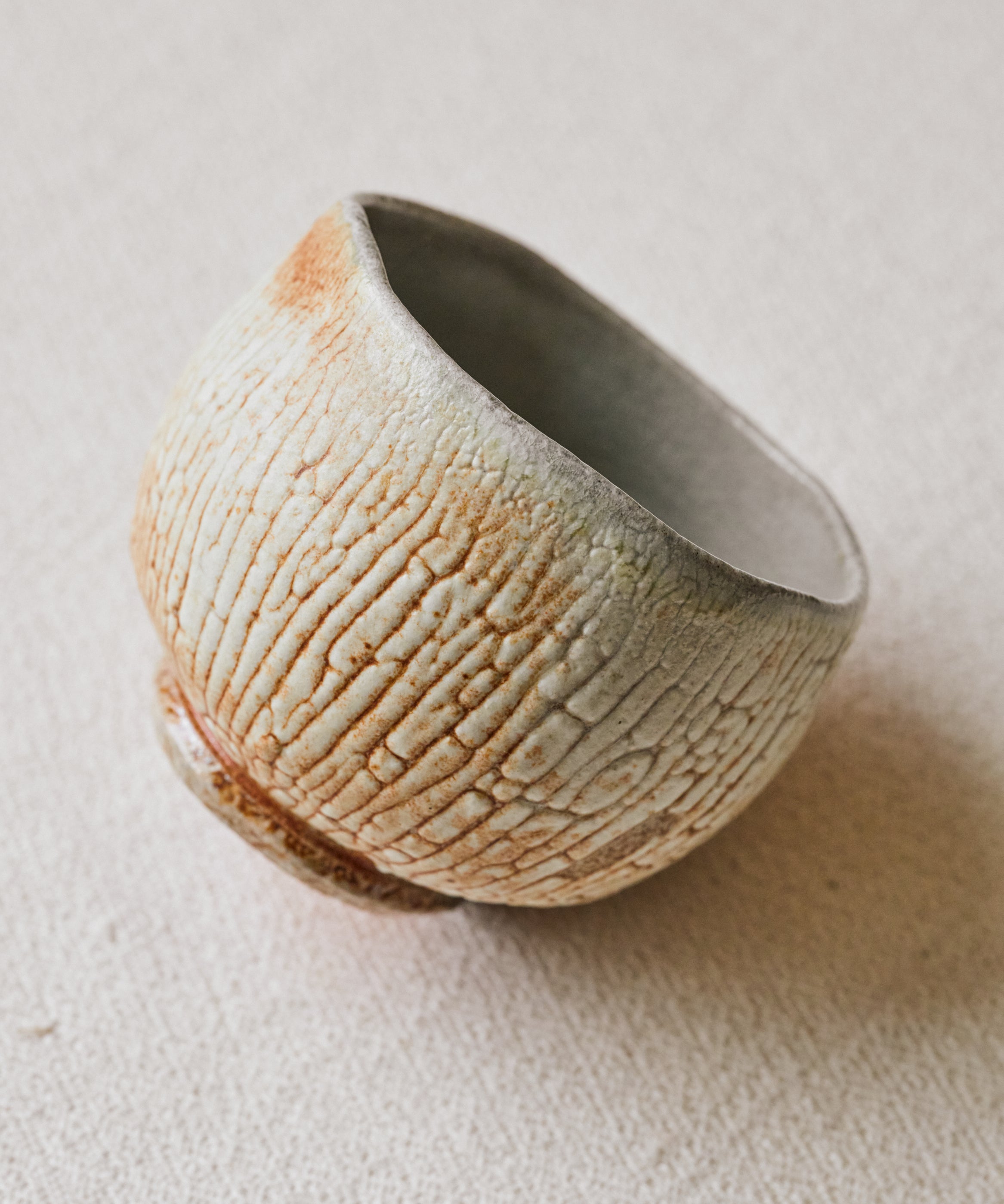 Chawan No. 71 exterior, shino glaze on wood-fired stoneware