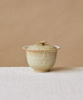 Ecru Seashell Gaiwan, handcrafted gaiwan by Wang Xinghua, Jingdezhen, spiral seashell glaze with kiln-fire markings