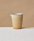 Clamshell Glaze Pitcher, handcrafted tea pitcher by Wang Xinghua, Jingdezhen, sand-toned glaze with calcification strata