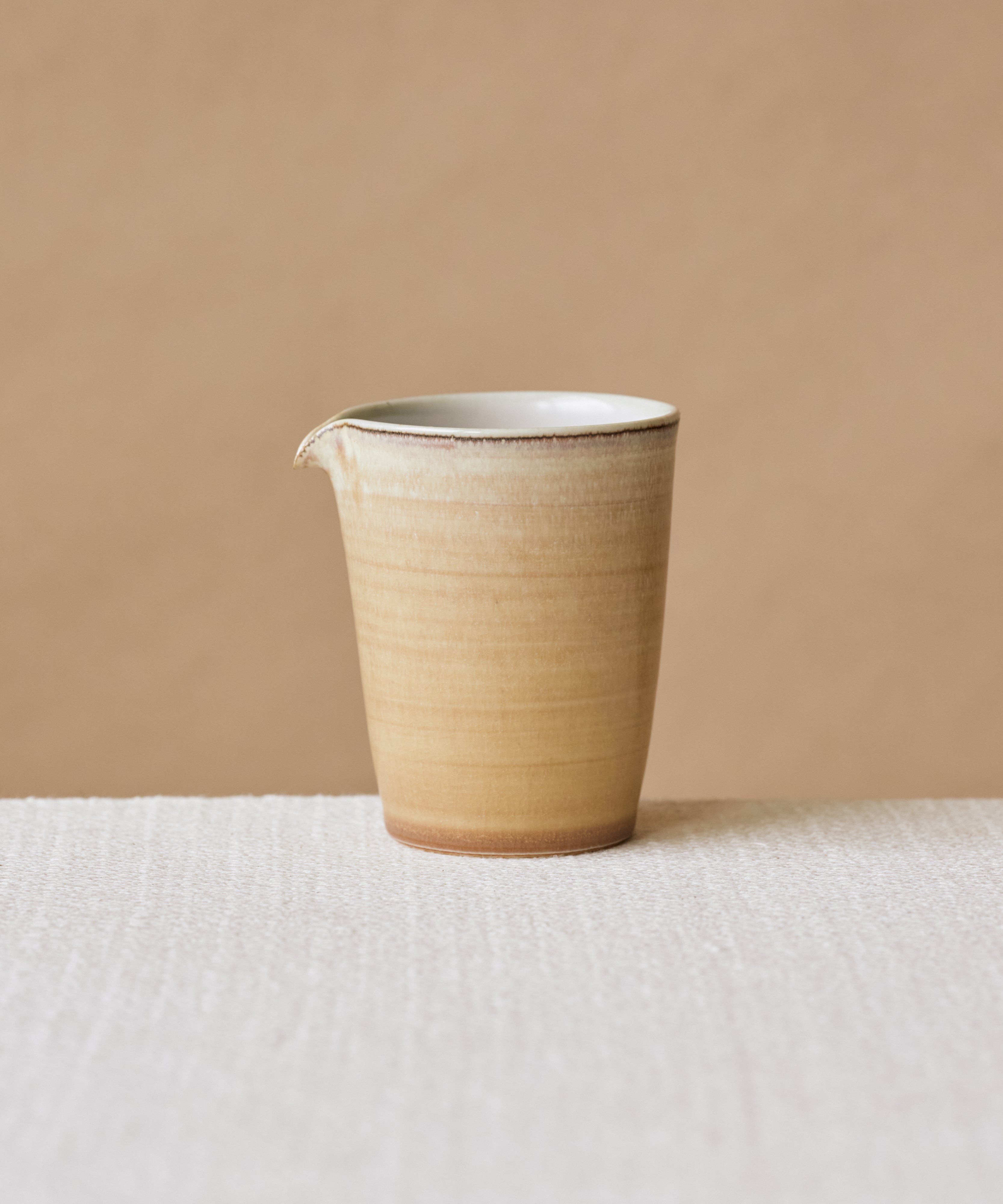 Clamshell Glaze Pitcher, handcrafted tea pitcher by Wang Xinghua, Jingdezhen, sand-toned glaze with calcification strata
