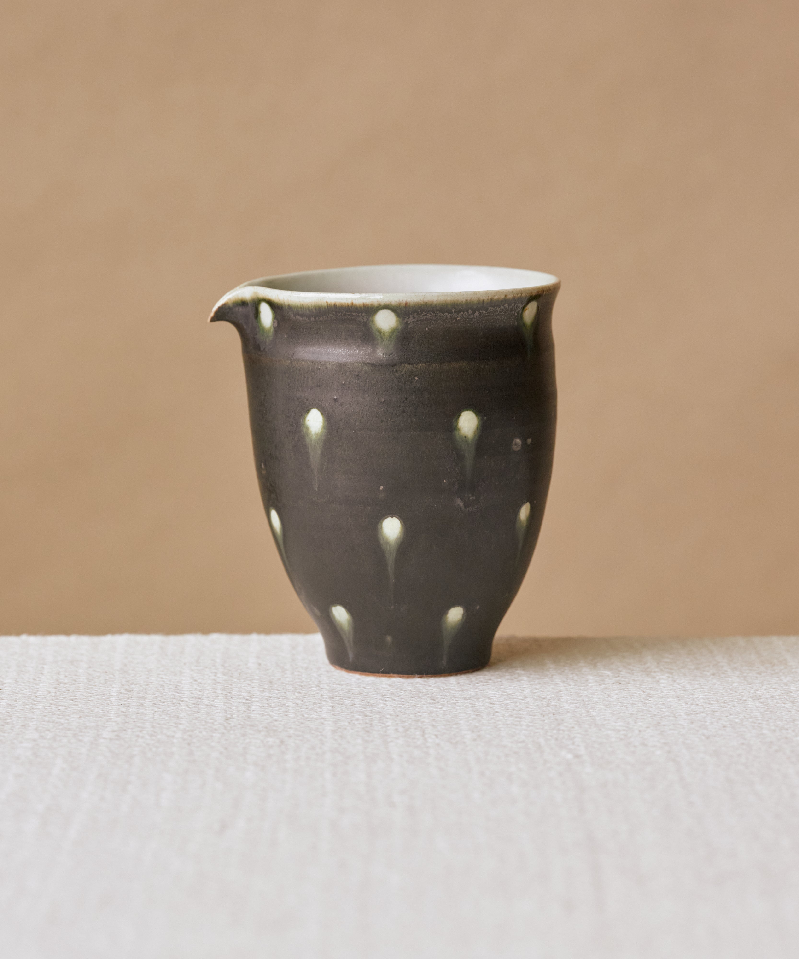 Black Peacock Pitcher Type I, handcrafted tea pitcher by Wang Xinghua, Jingdezhen, black peacock glaze