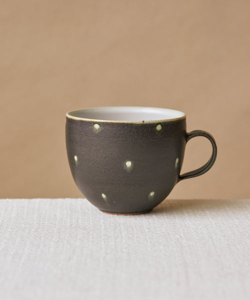Black Peacock Mug, handcrafted mug by Wang Xinghua, Jingdezhen, peacock feather teardrops on matte midnight glaze