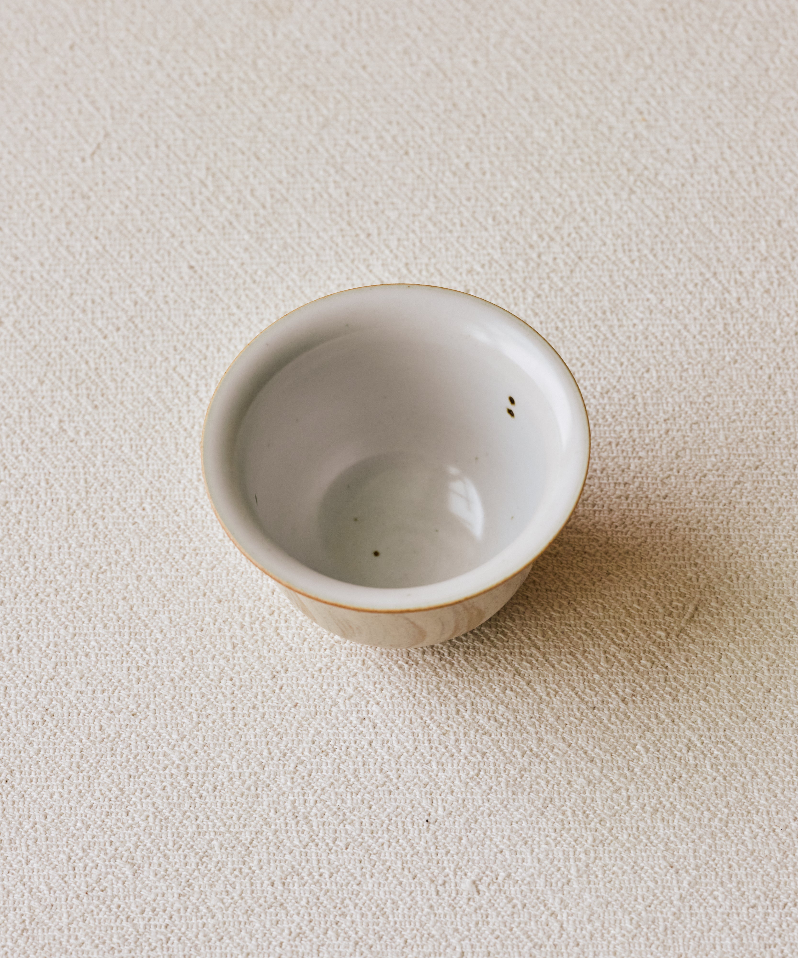 Matte Blush Gaiwan glaze detail, matte pink with sandy texture, reduction-fired at 1300°C, Jingdezhen