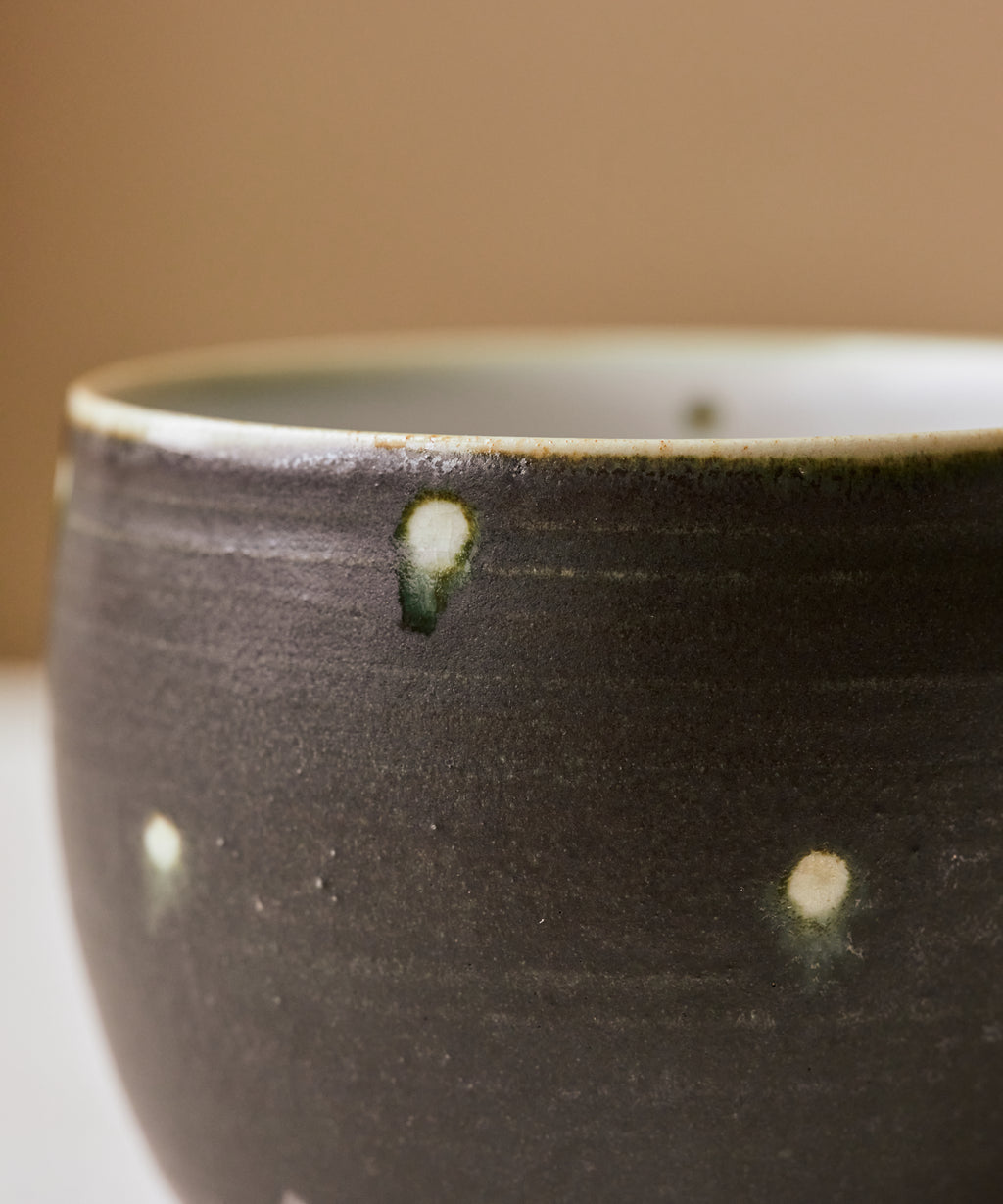 Black Peacock Mug side view, matte midnight glaze with peacock markings, Wang Xinghua, Jingdezhen