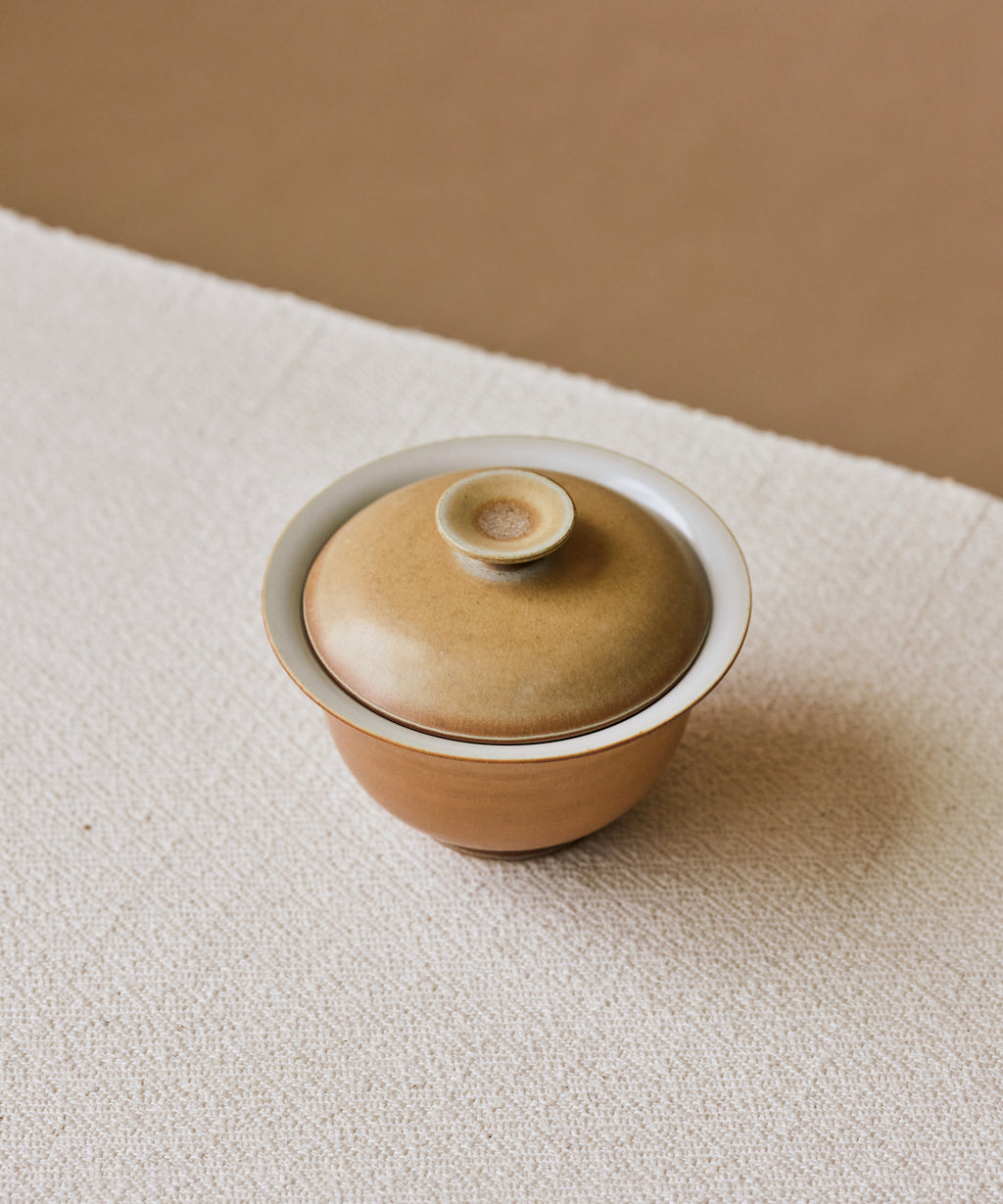 Clamshell V1 Gaiwan in hand, shell-like glaze with calcification rings, Wang Xinghua gongfu teaware