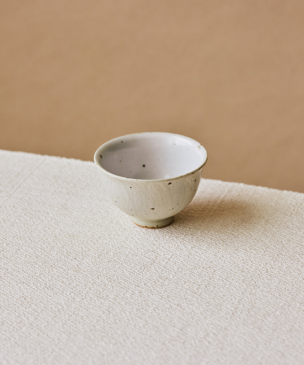 Rock Cup in hand, sage green striations on textured surface, Wang Xinghua gongfu teaware, Jingdezhen