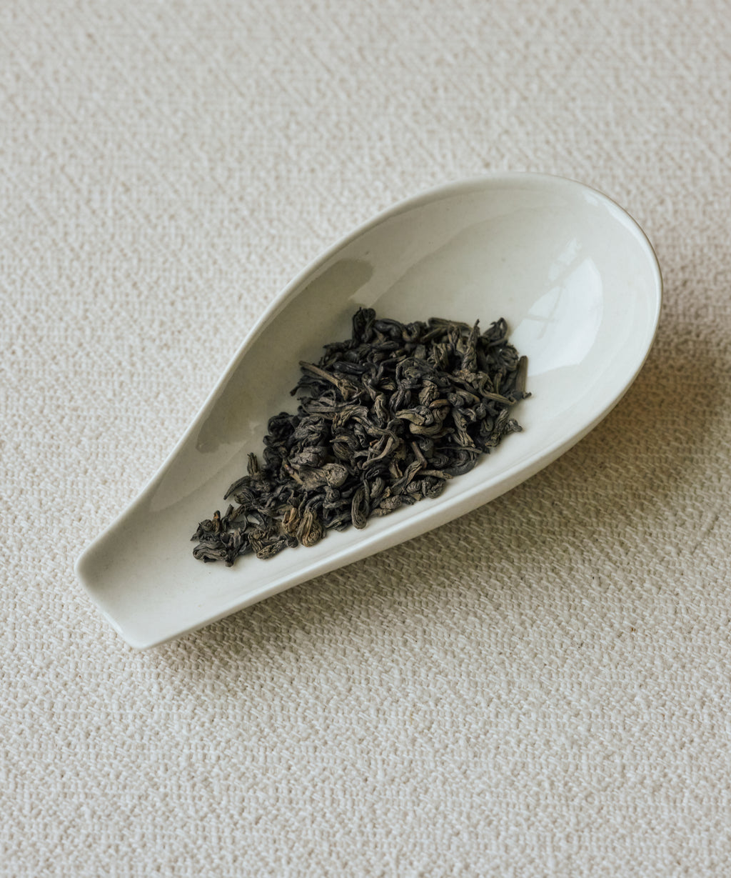 Charcoal Roasted Tibetan Tea leaves in a gaiwan ready for brewing
