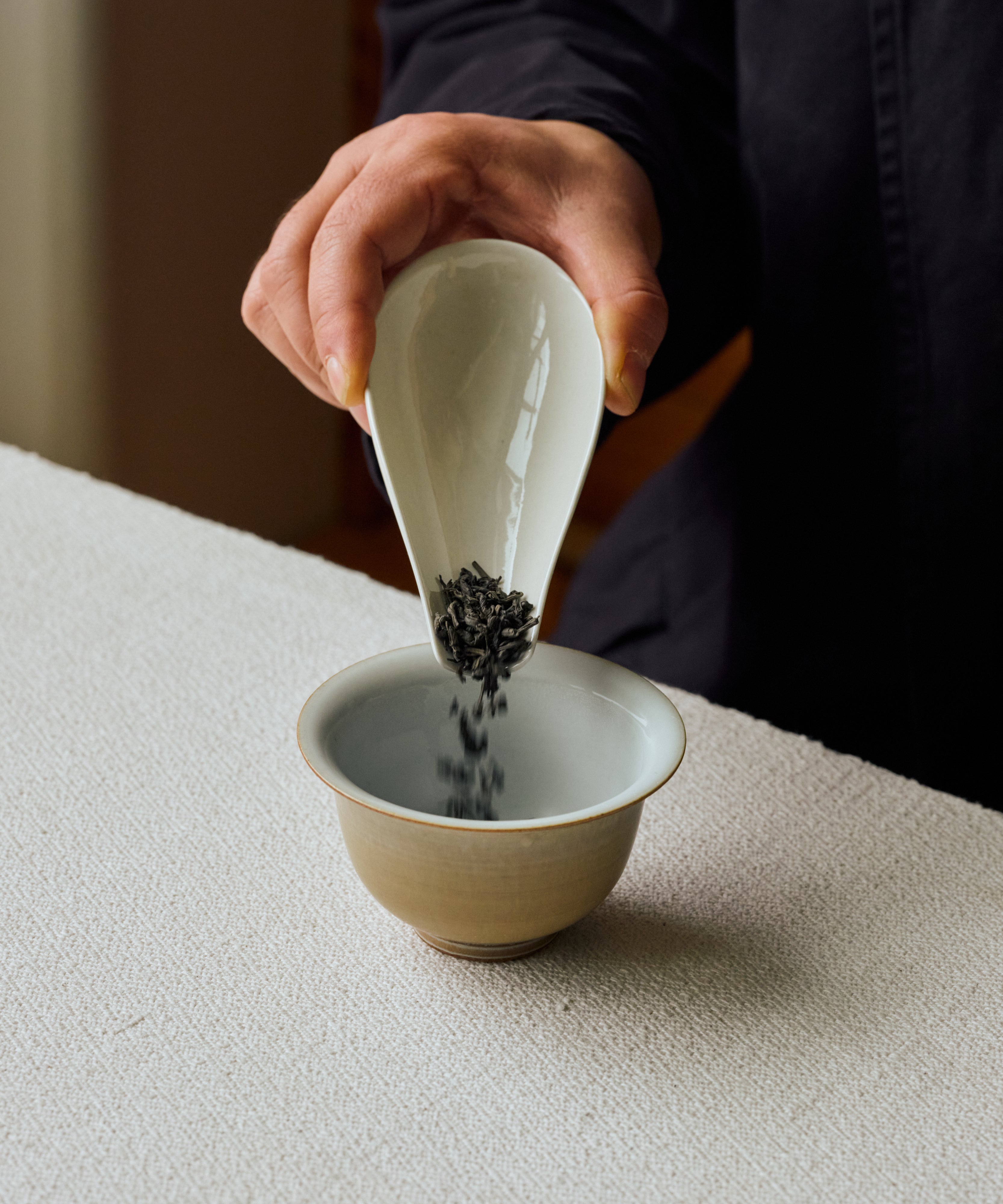 Hot water poured over Charcoal Roasted Tibetan Tea in a gaiwan