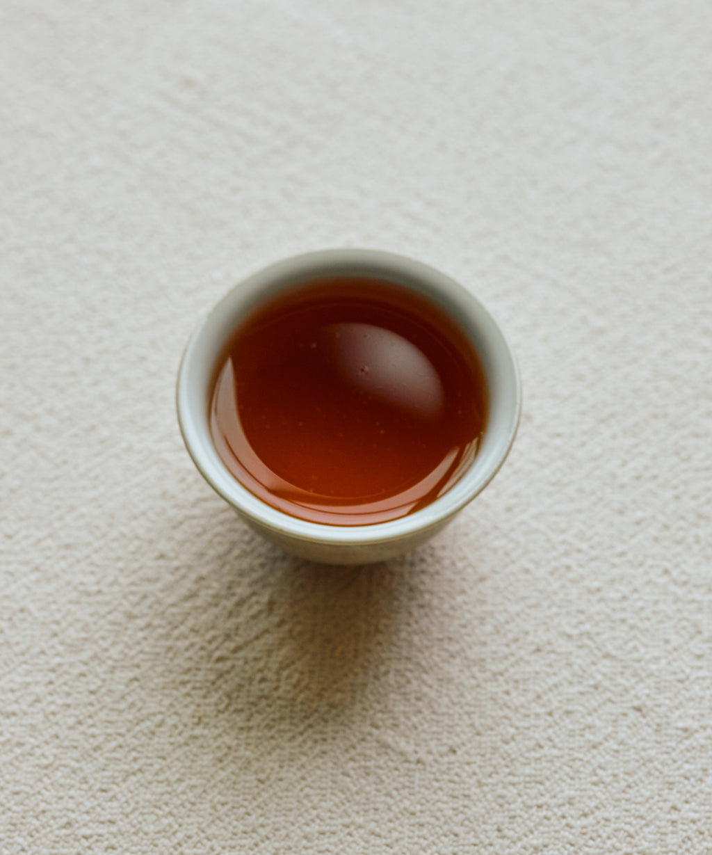Detail of Charcoal Roasted Tibetan Tea liquor showing fruity warming character