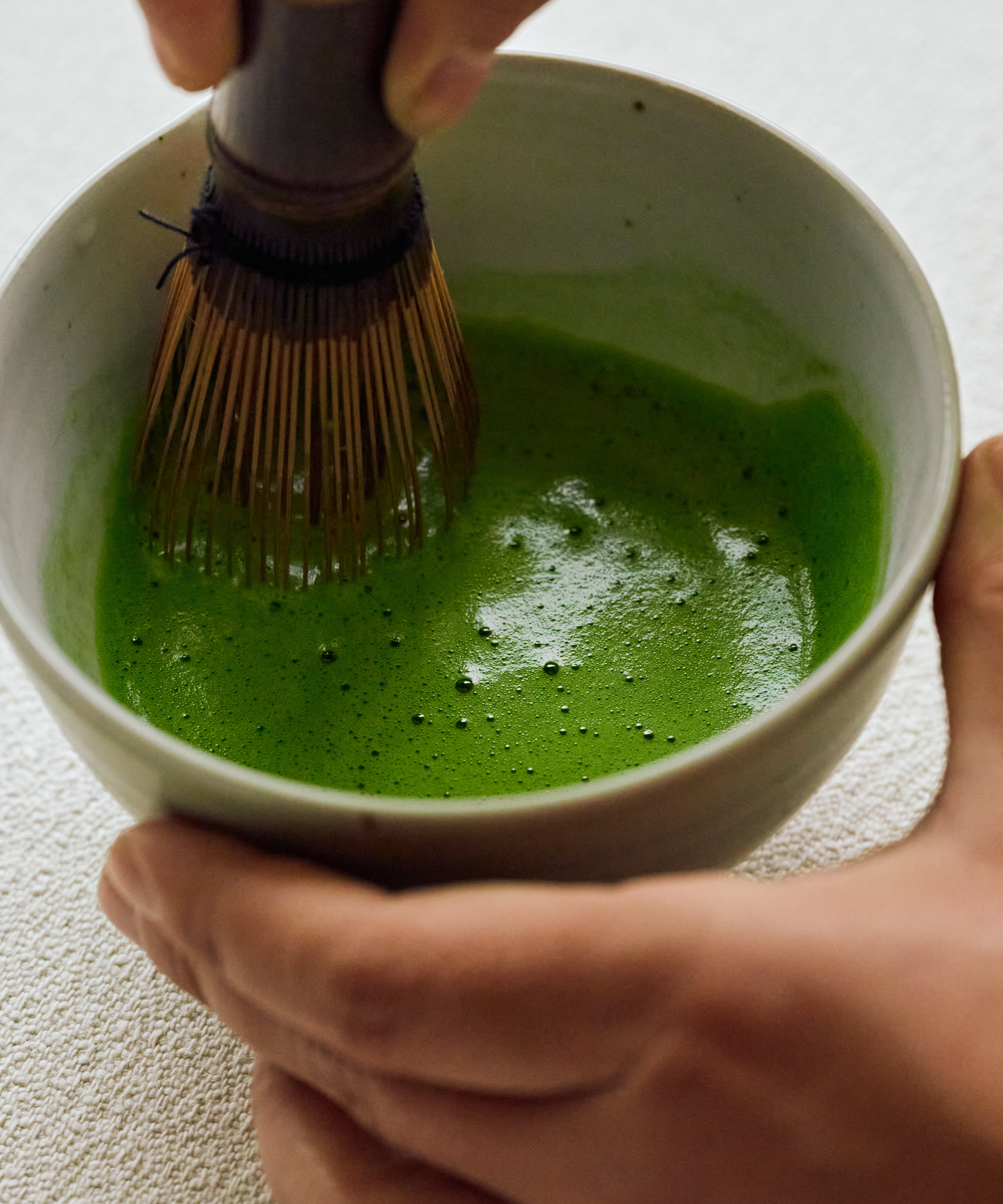 Whisked Genmaicha Matcha in bowl — smooth, bright foam with comforting rice cracker notes