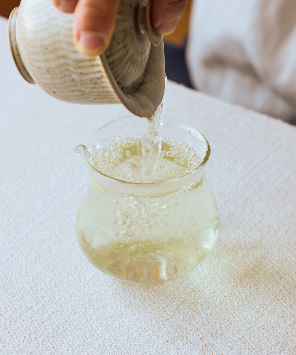 Pouring Huoqing Fire Jade from pitcher — rare Anhui green tea with tree bark aroma and deep energy