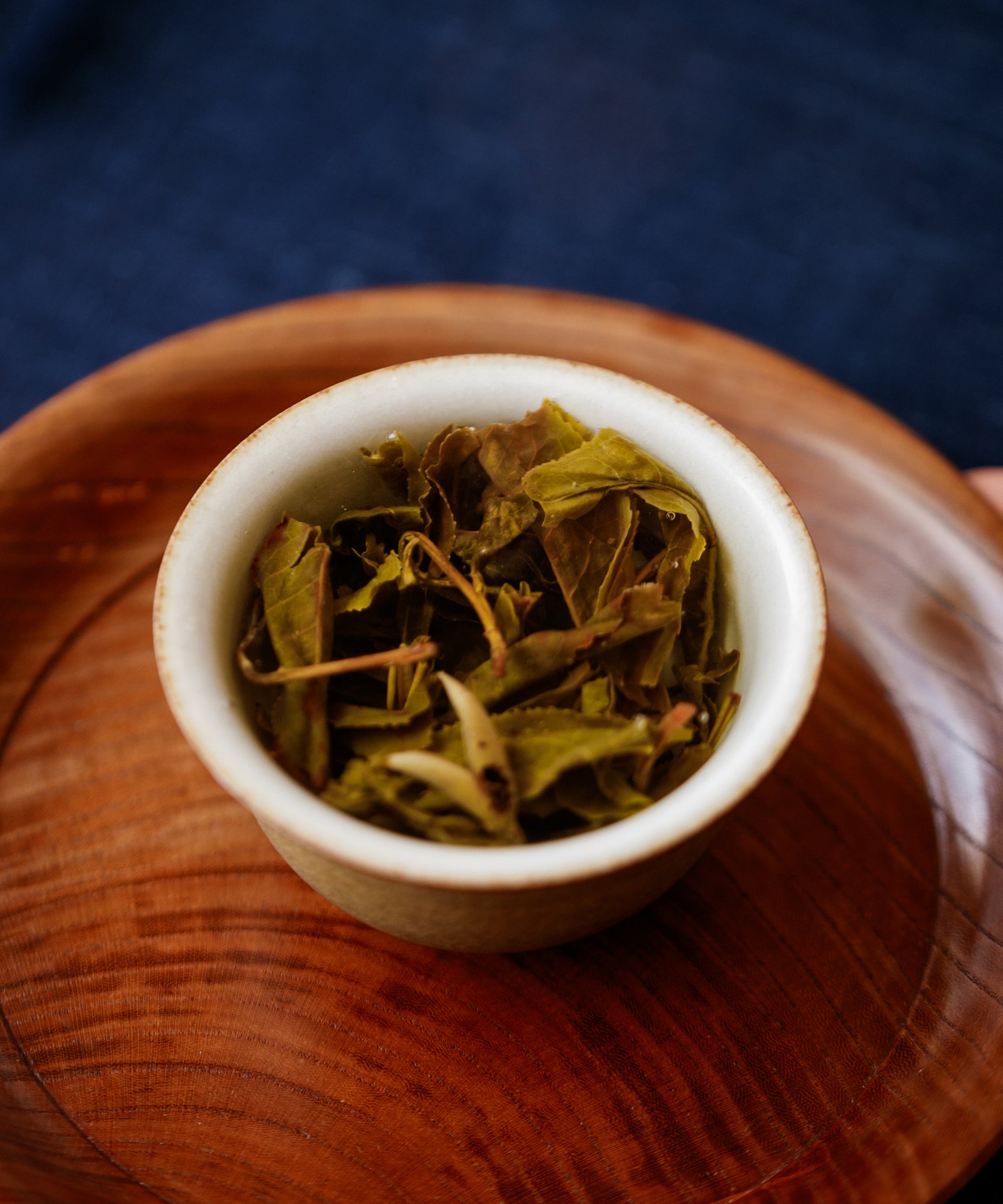 Dry Pine & Moon leaves in a wooden cup ready for brewing