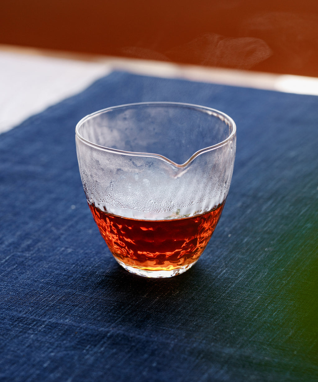 Thirteen-years Liubao liquor — ruby red with wet rock, mineral pitch, and ferment notes