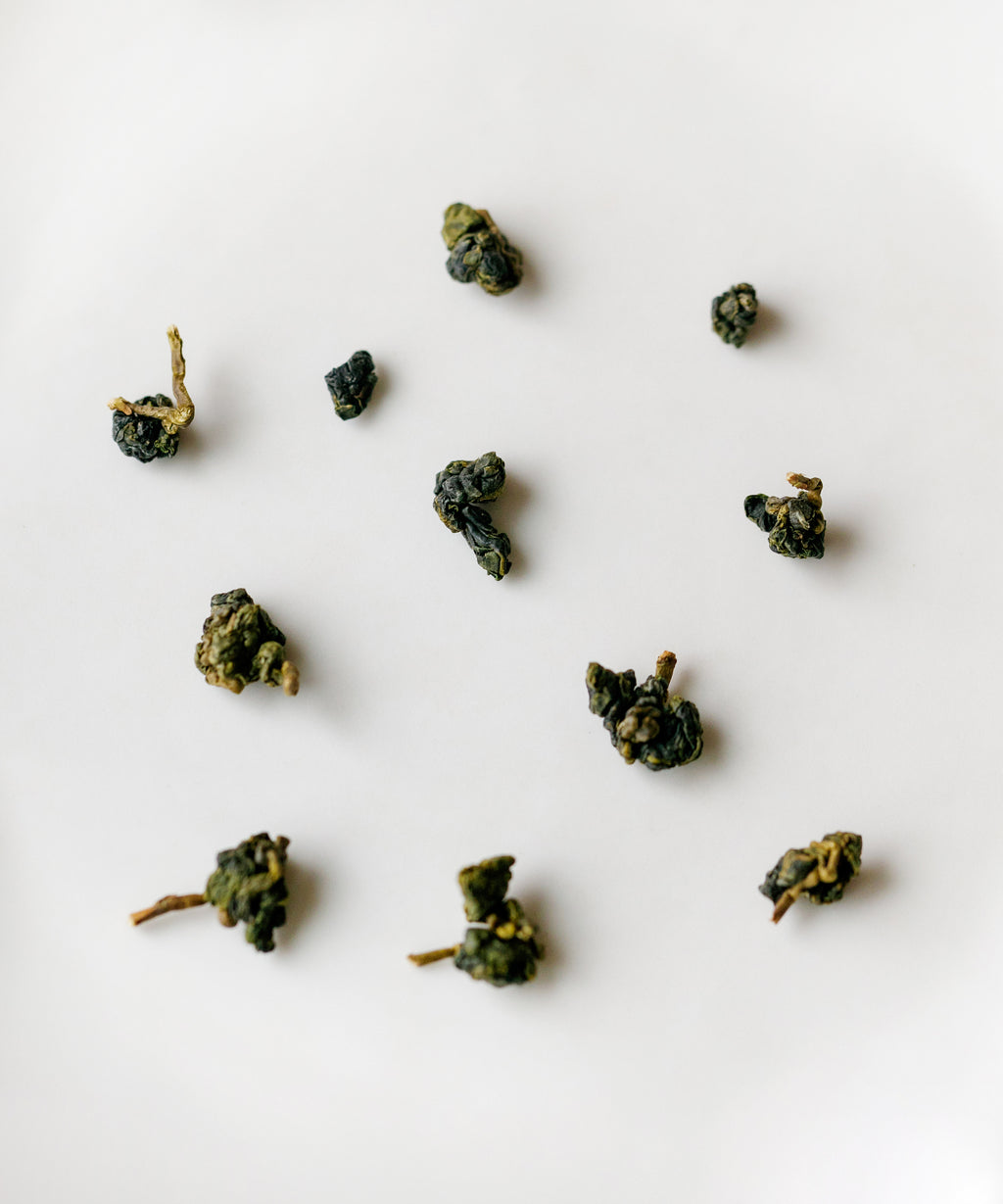 Alishan High Mountain dry rolled oolong leaves close-up — high-altitude indigenous varietal, November 2025 harvest