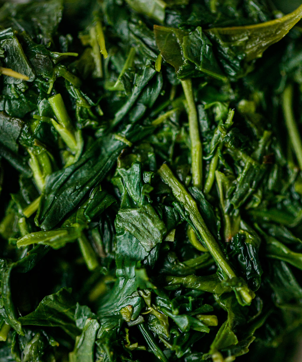 Wet Yame Gyokuro Kyoku leaves after brewing, showing vibrant stems