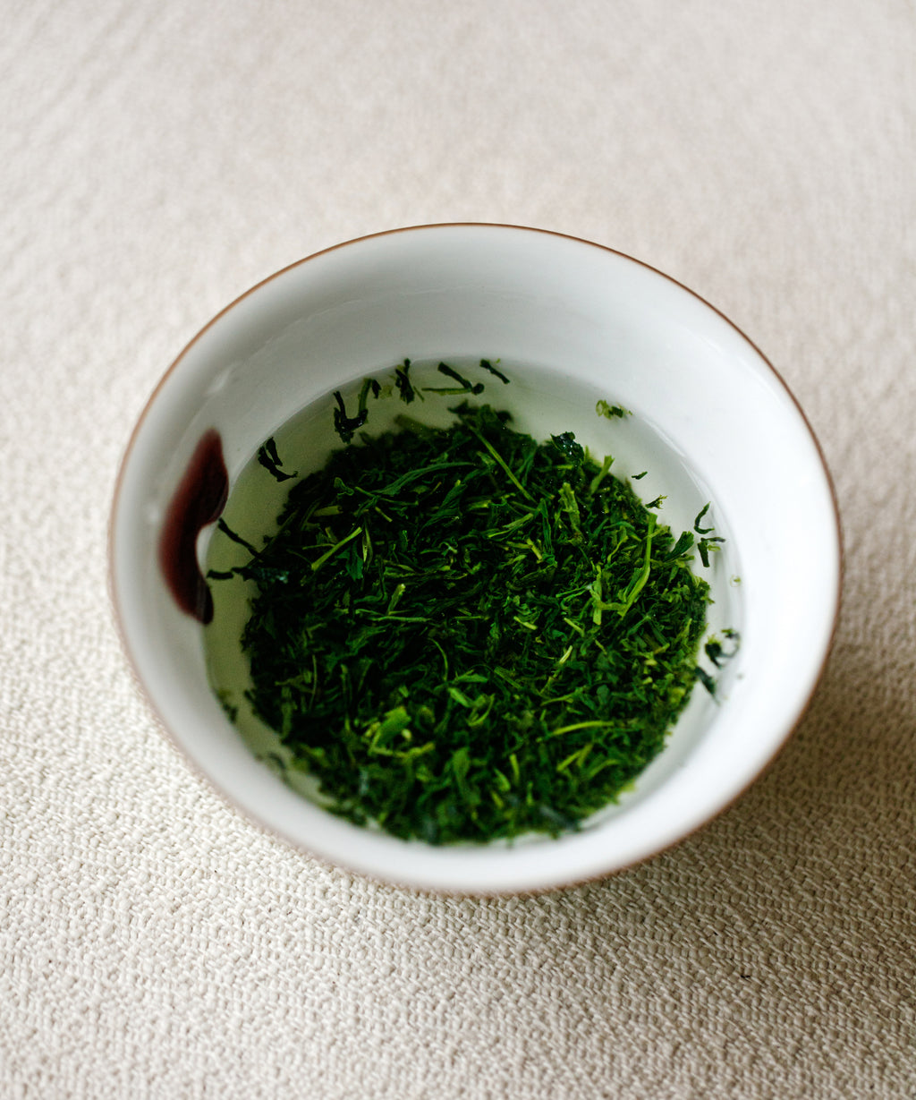 Detail of Yame Gyokuro Mei showing deep green needle-shaped leaves
