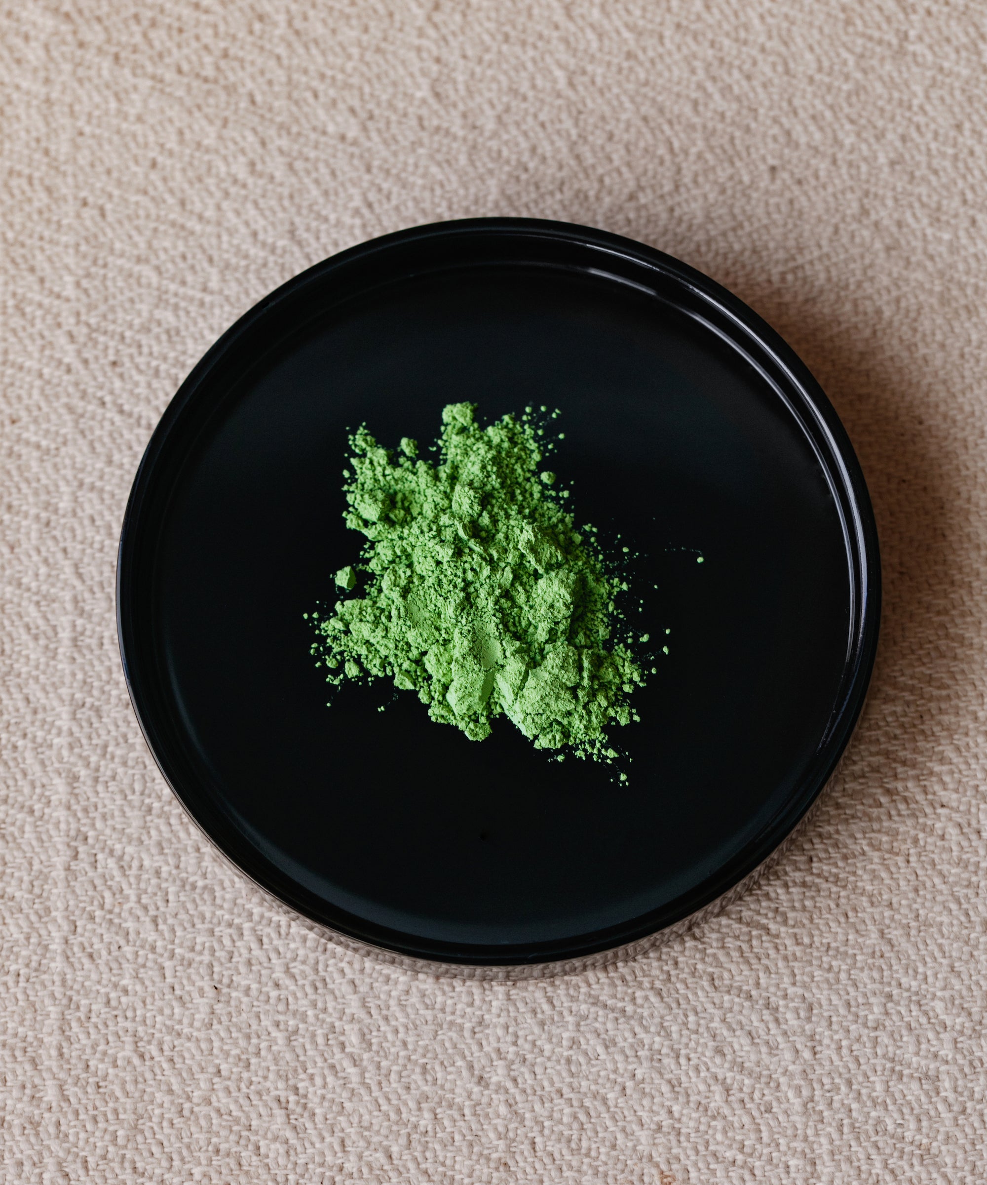 Matcha Hana Japanese latte grade matcha powder from Nishio in black bowl