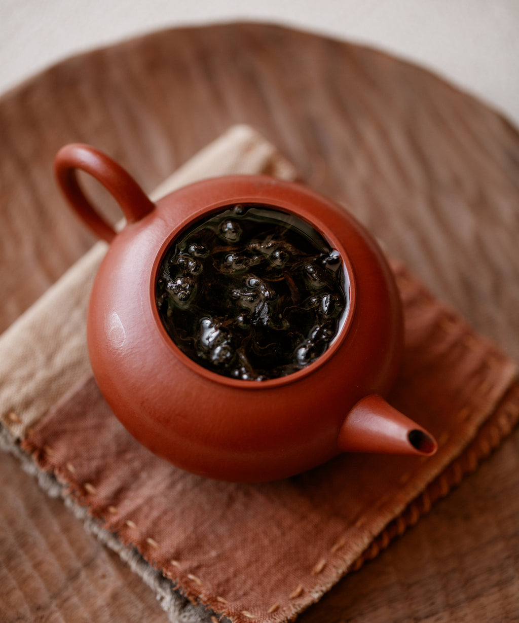 Hot water poured over Lapsang Souchong 2012 leaves in a gaiwan