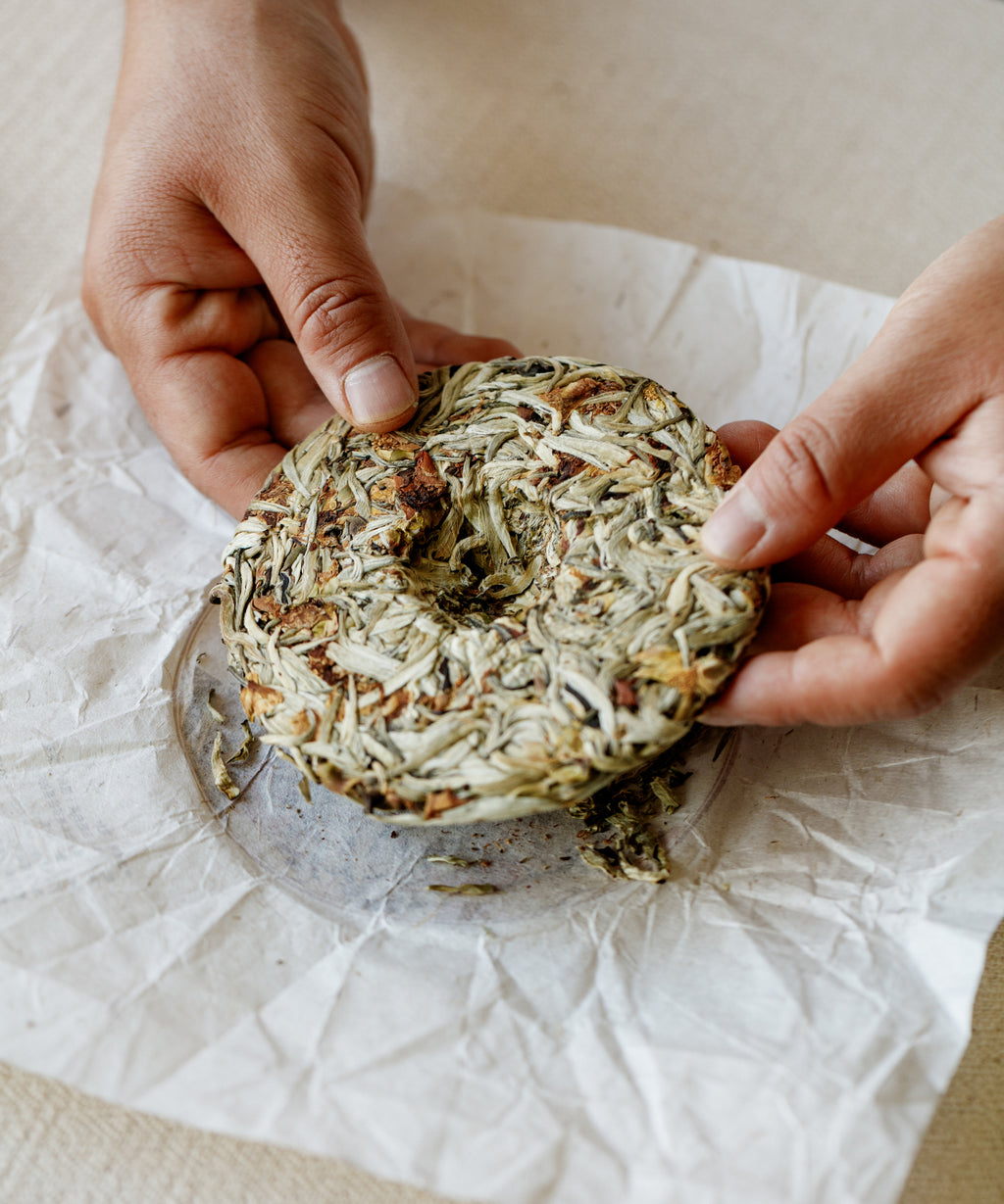 Silver Needle & Tea Blossoms pressed cake top view