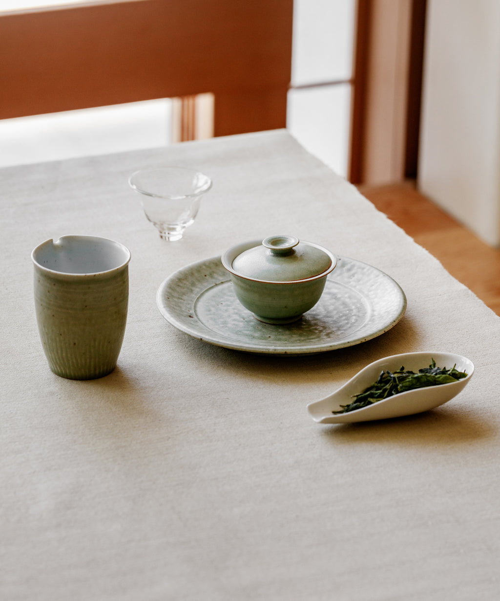 Brewing Melon Flake in a gaiwan, flattened leaves expanding like sea lettuce in water