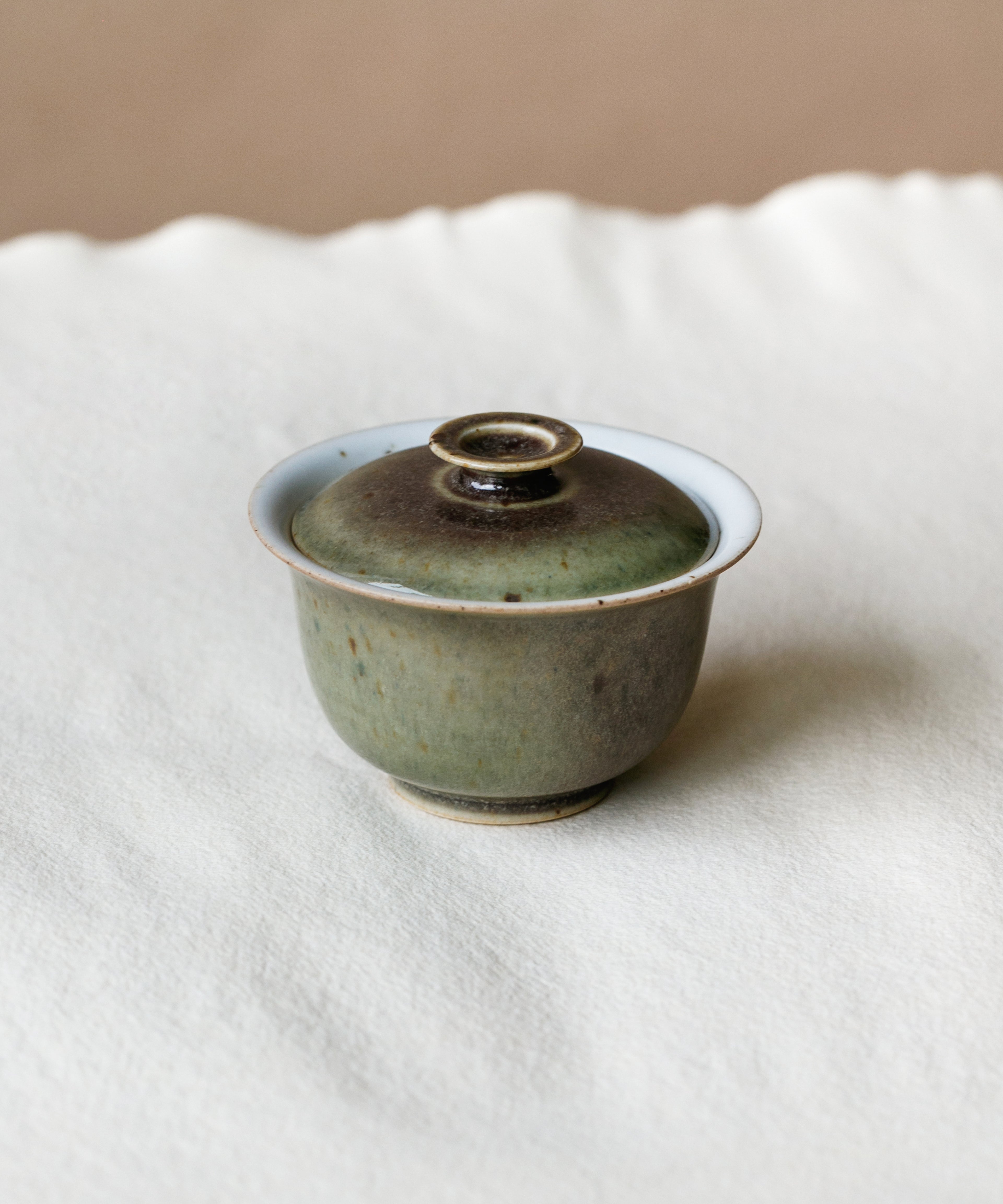 Small Purple Rain Gaiwan in hand, purple rain glaze showing scale, Wang Xinghua gongfu teaware