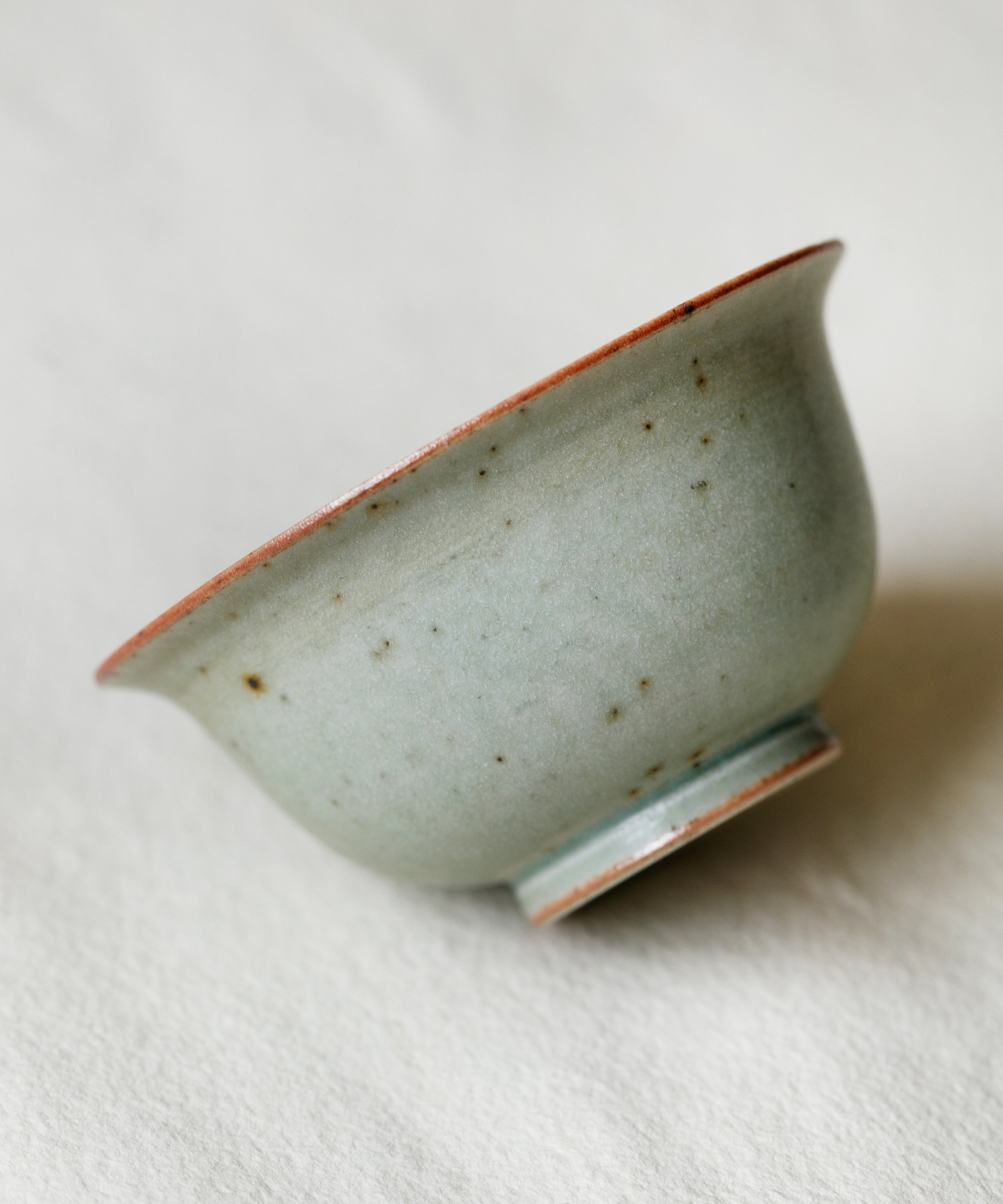Mini Celadon Green Gaiwan in hand, celadon green glaze showing scale, Wang Xinghua gongfu teaware