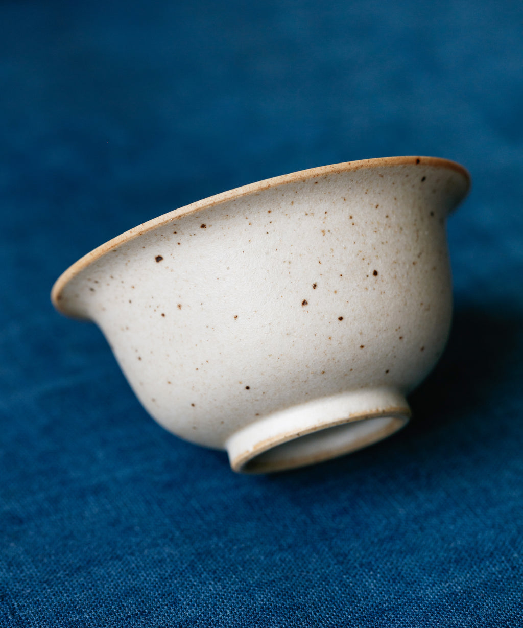 Small Sunrise Matte Gaiwan in hand, warm sunrise matte glaze showing scale, Wang Xinghua gongfu teaware