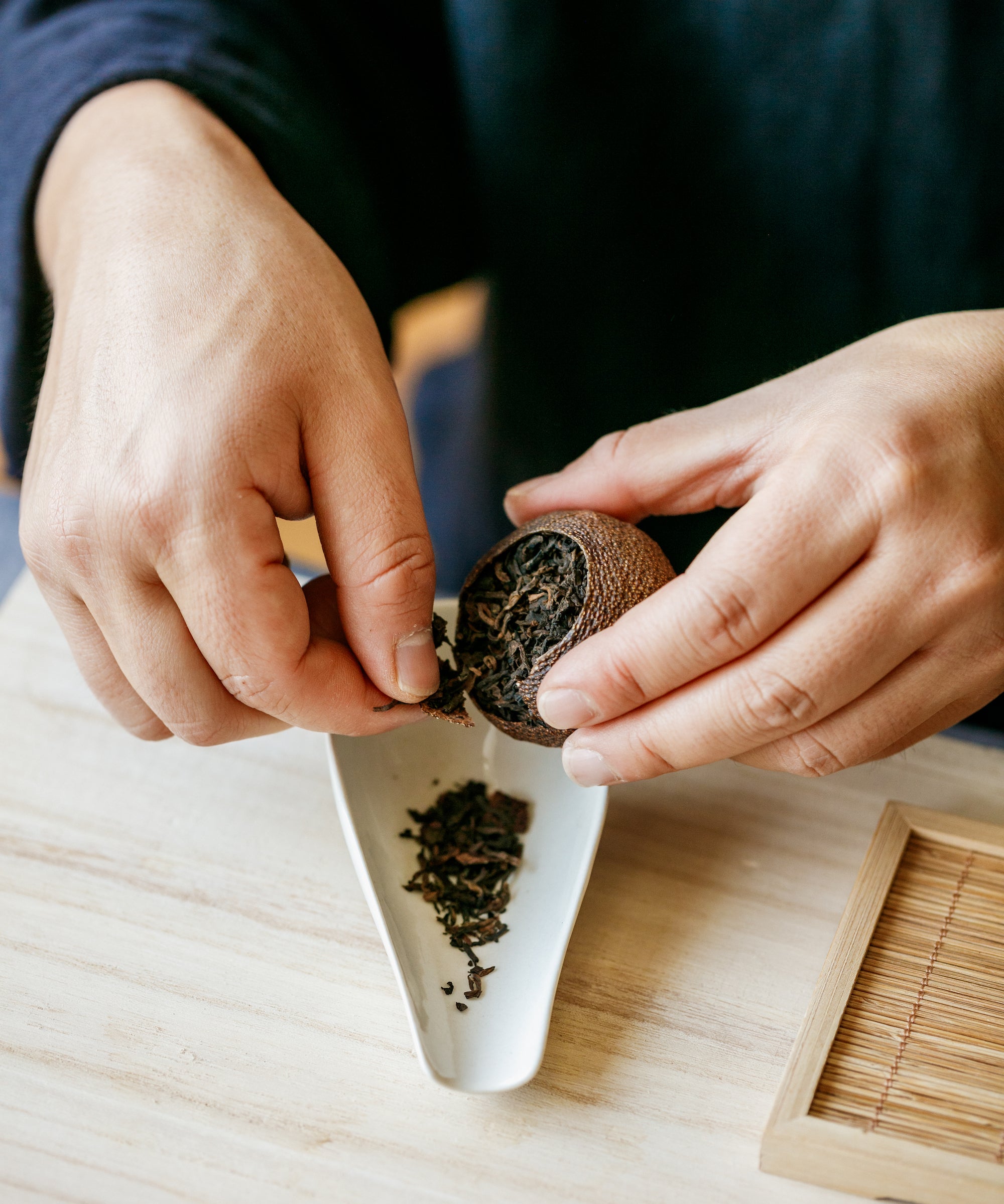 Imperial Pu'erh in Red Mandarin liquor — clear bronze with sweet, oily orange peel and clean pu'erh