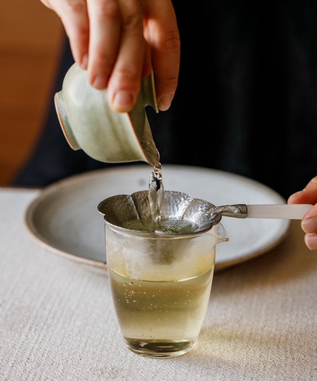 Hand-prepared Jasmine Snow Flake brewing in the traditional Zen meditation style