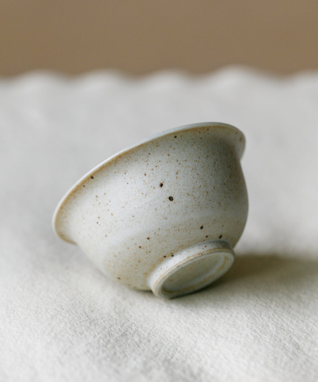 Matte Sunrise Cup in hand, warm sunrise glaze, Wang Xinghua gongfu teaware, Jingdezhen