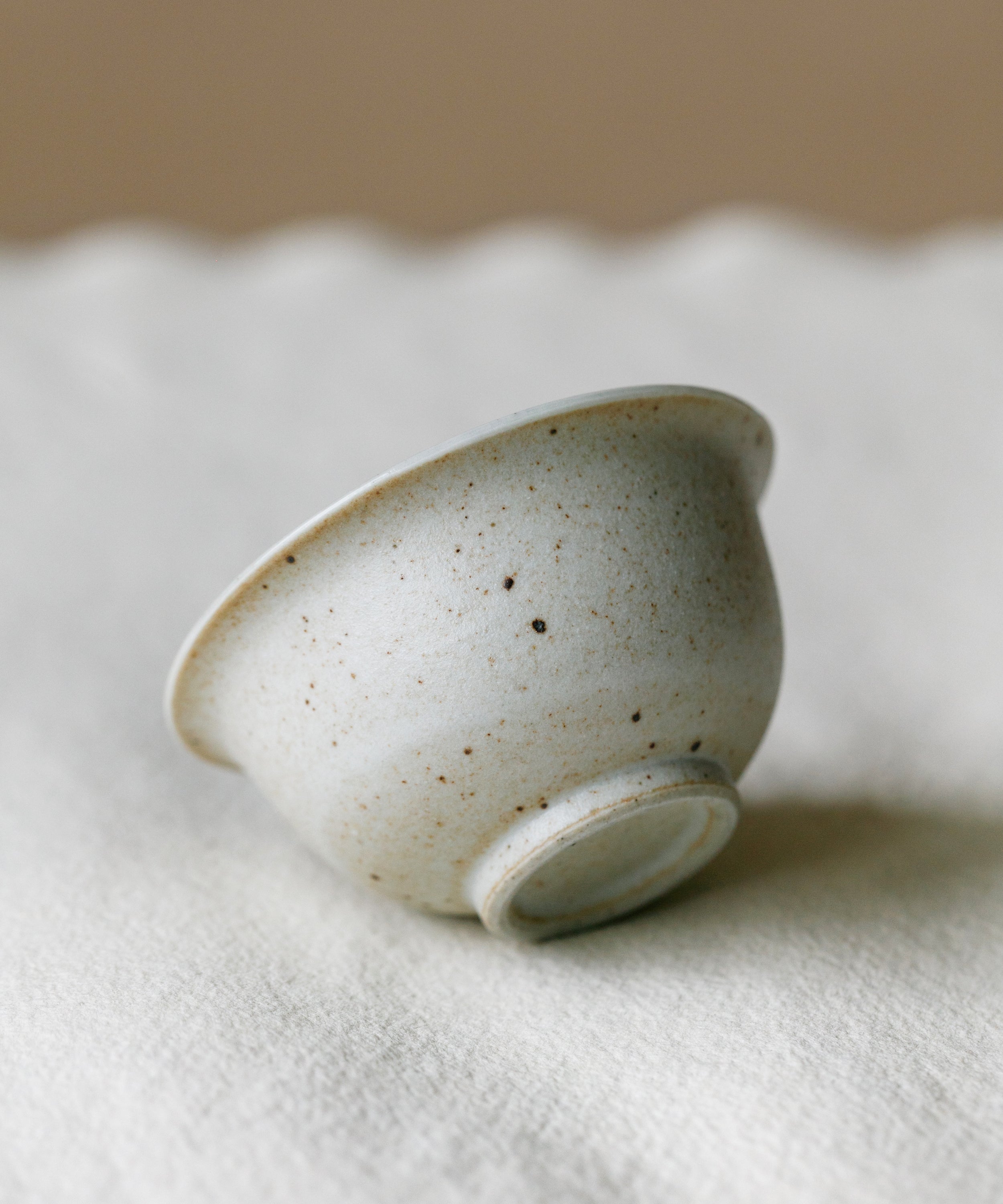Matte Sunrise Cup in hand, warm sunrise glaze, Wang Xinghua gongfu teaware, Jingdezhen