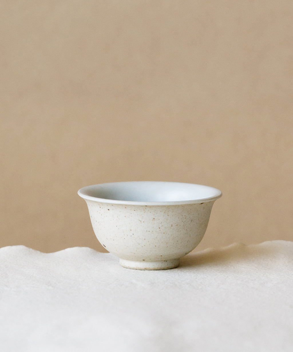 Matte Sunrise Cup, handcrafted tea cup by Wang Xinghua, Jingdezhen, matte sunrise glaze in warm tones