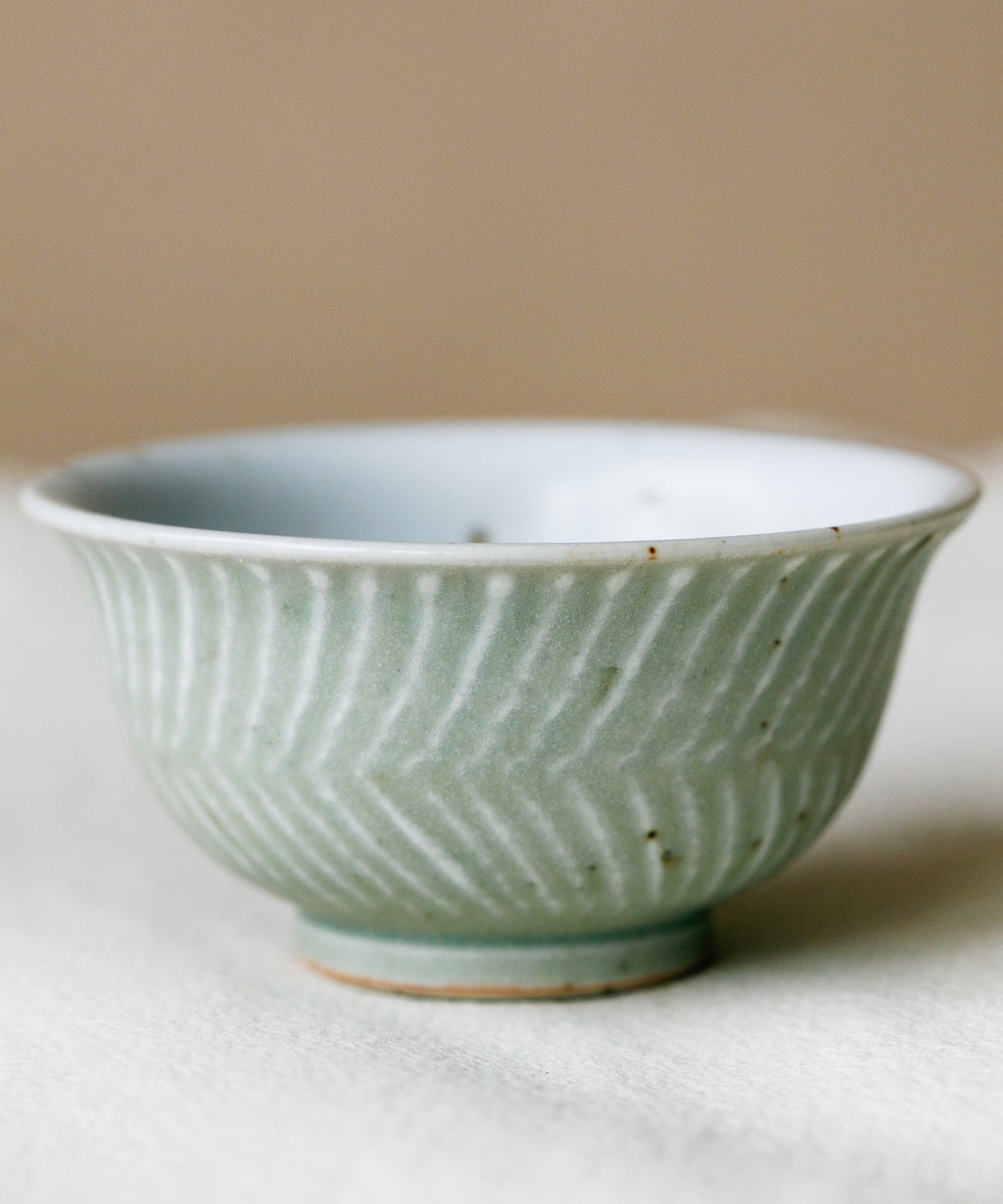 Green Waves Cup in hand, green waves glaze pattern, Wang Xinghua gongfu teaware, Jingdezhen