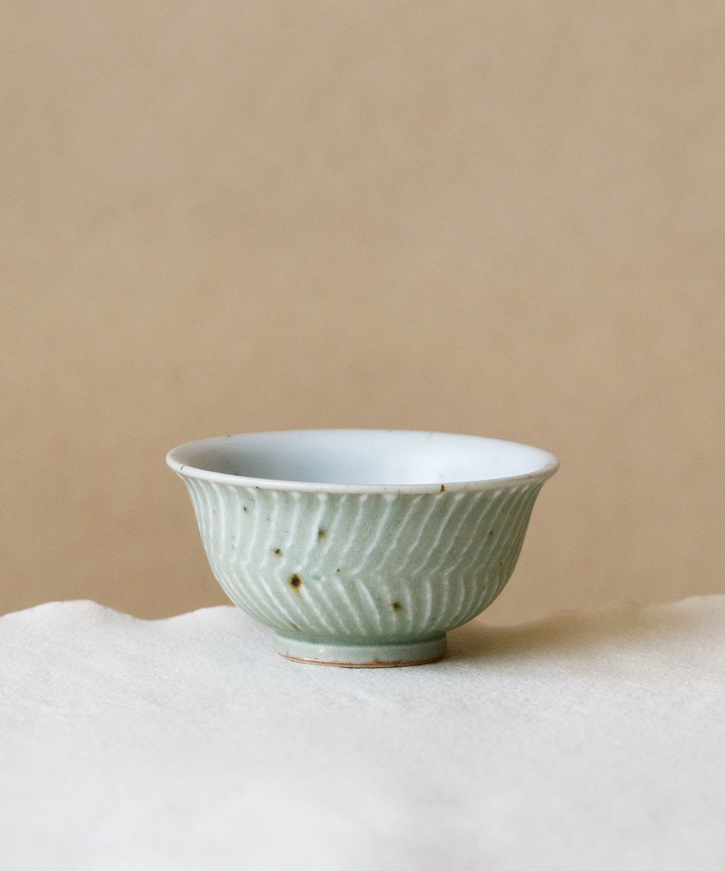 Green Waves Cup, handcrafted tea cup by Wang Xinghua, Jingdezhen, green waves glaze