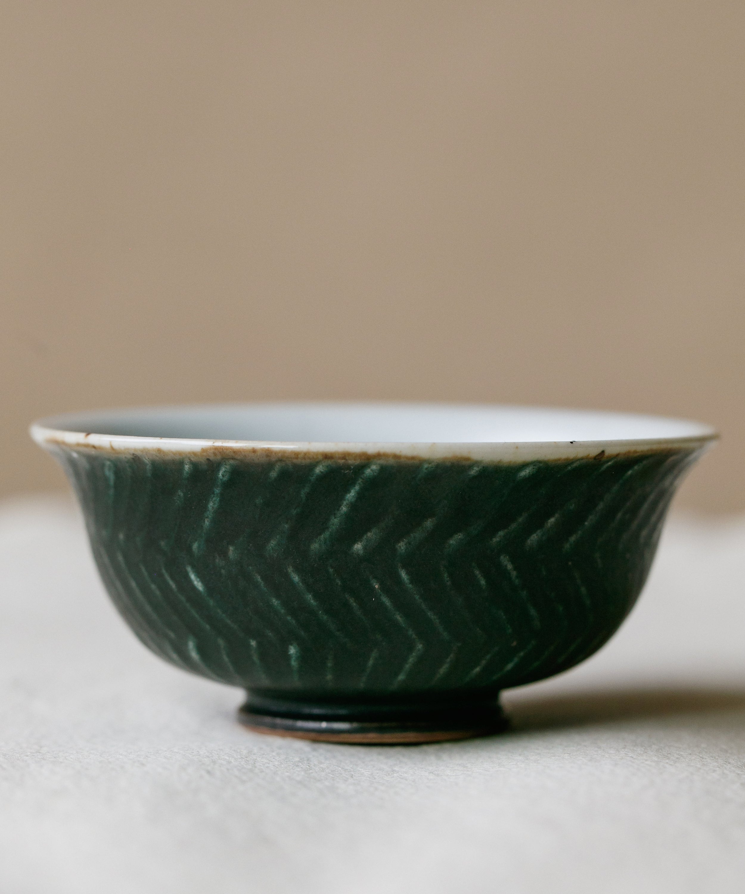 Forest Green Cup in hand, forest green glaze, Wang Xinghua gongfu teaware, Jingdezhen