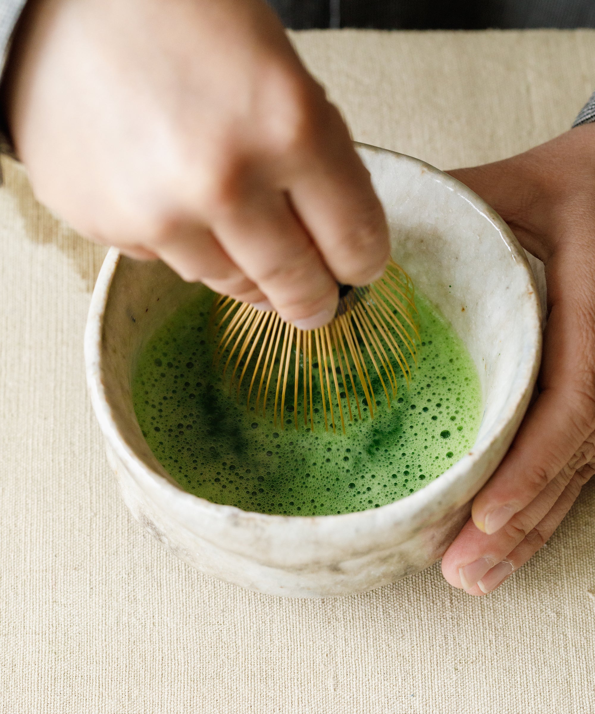 Whisking Matcha Kotobuki with bamboo chasen — lime green froth, toasted nori and white soya sauce aroma