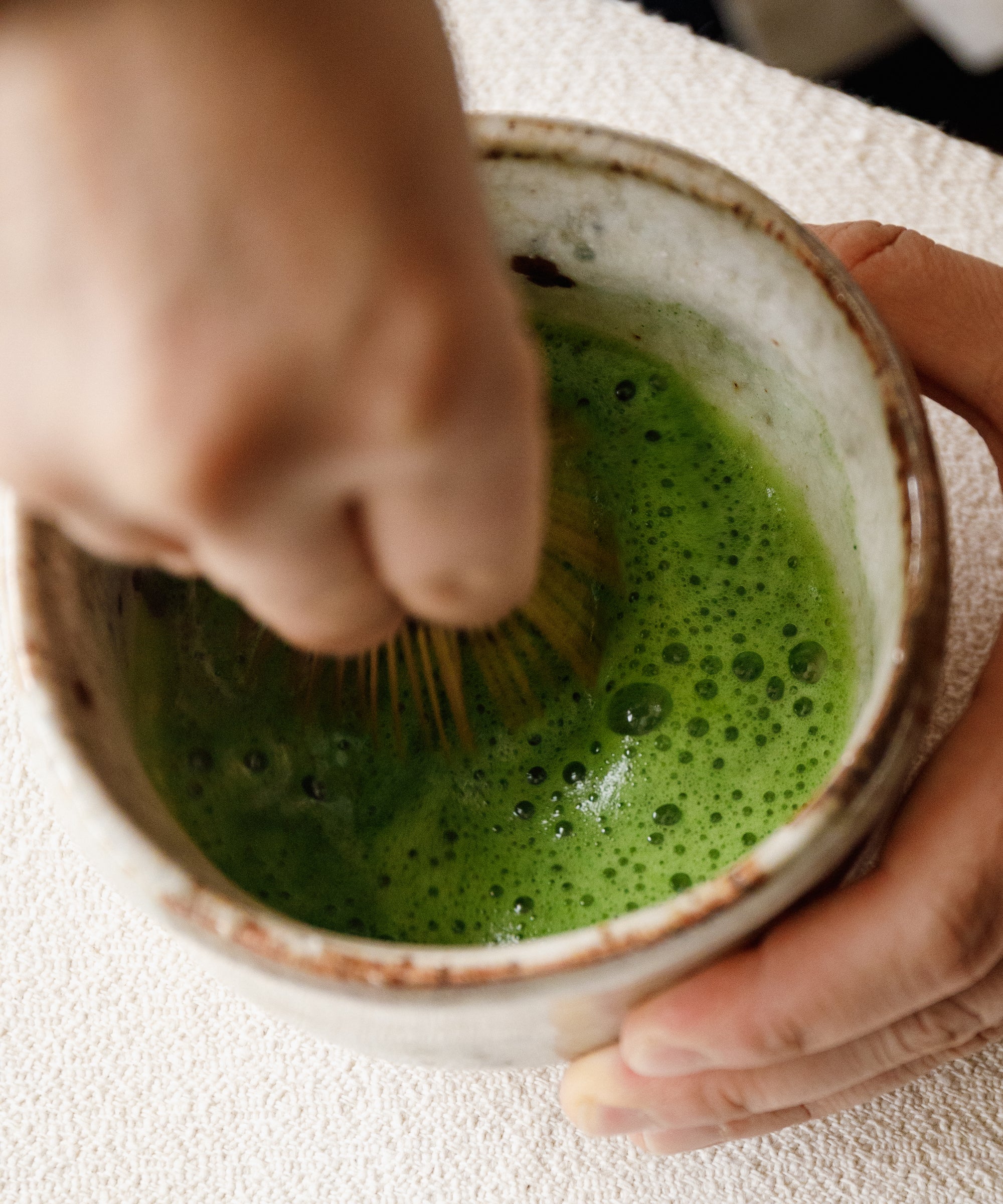 Top-down view of whisked Goku Mukashi usucha showing rich green color
