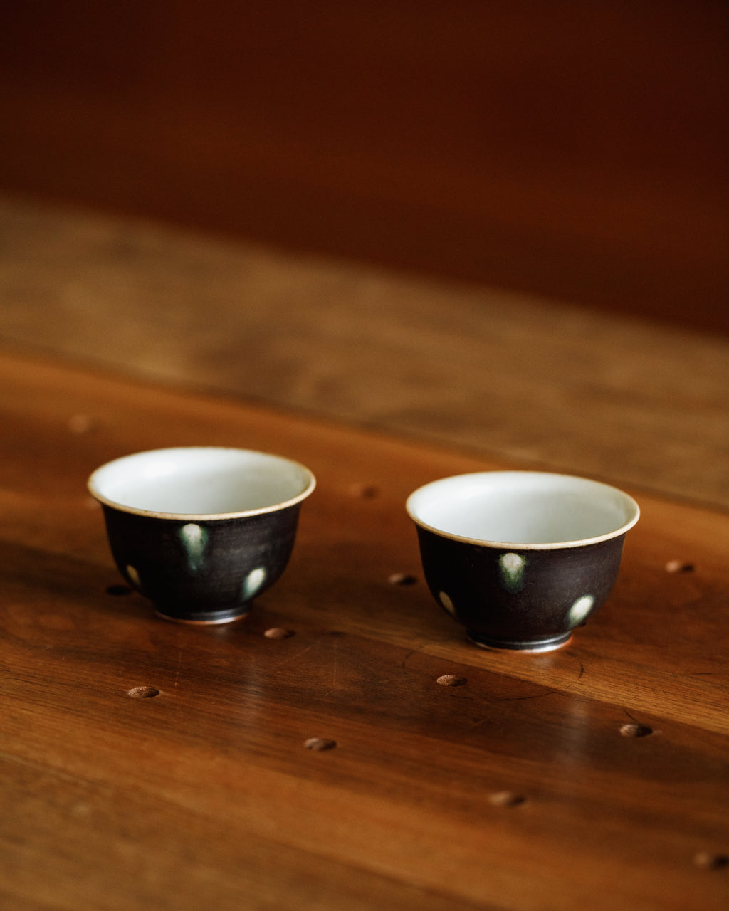 Cup Black Peacock underside, unglazed foot ring, Jingdezhen clay body, Wang Xinghua
