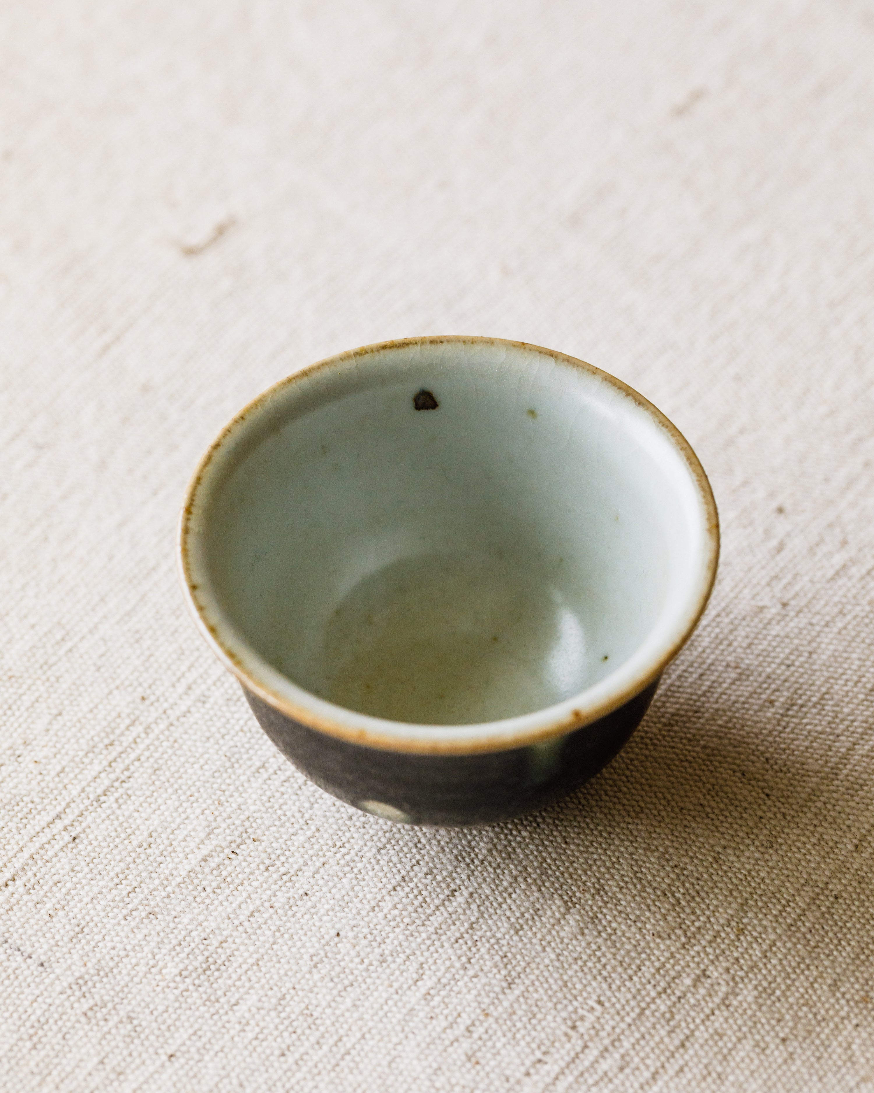 Cup Black Peacock glaze detail, peacock-feather markings, Jingdezhen clay and porcelain