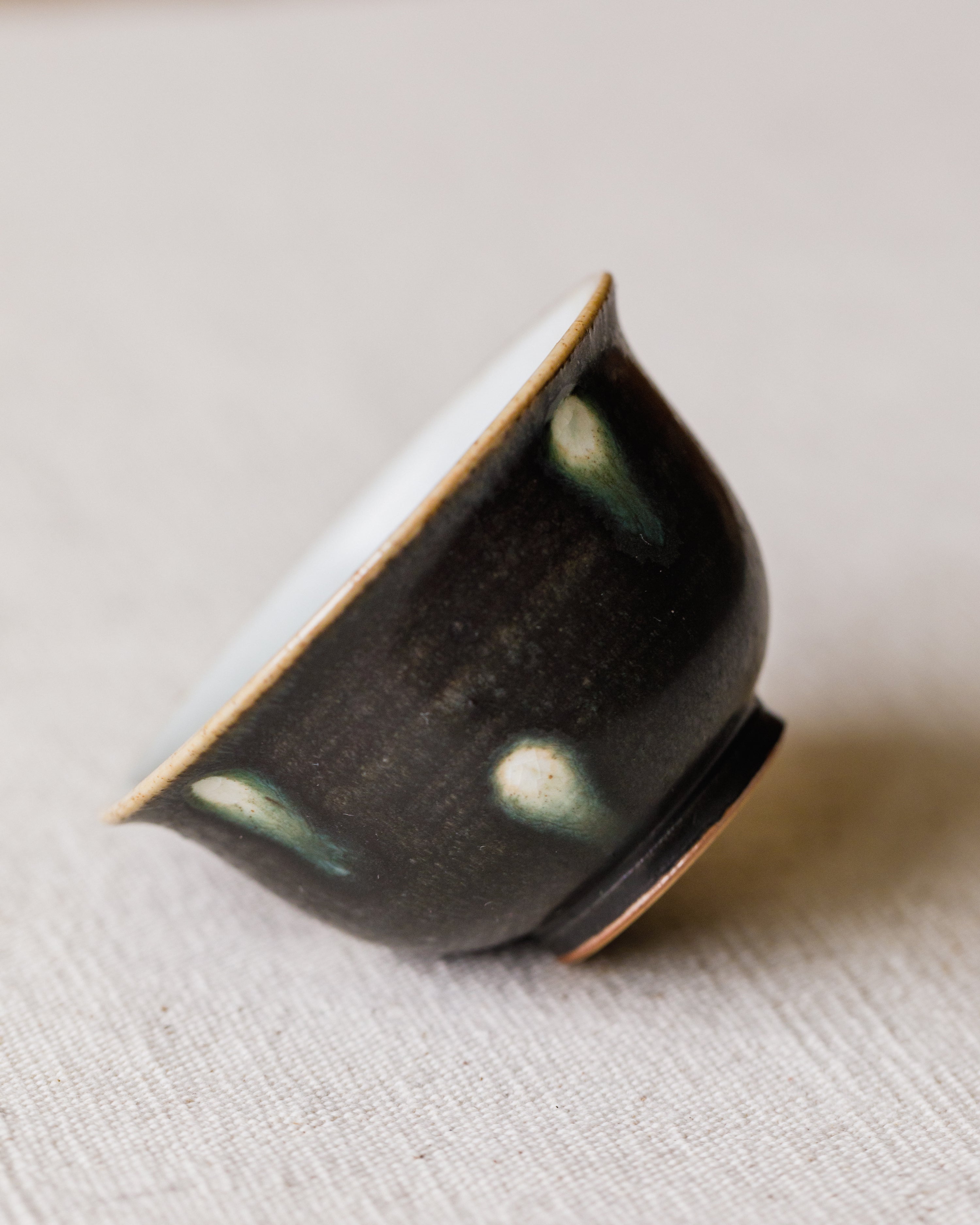 Cup Black Peacock interior, matte black with green rings and white spots, Wang Xinghua, Jingdezhen