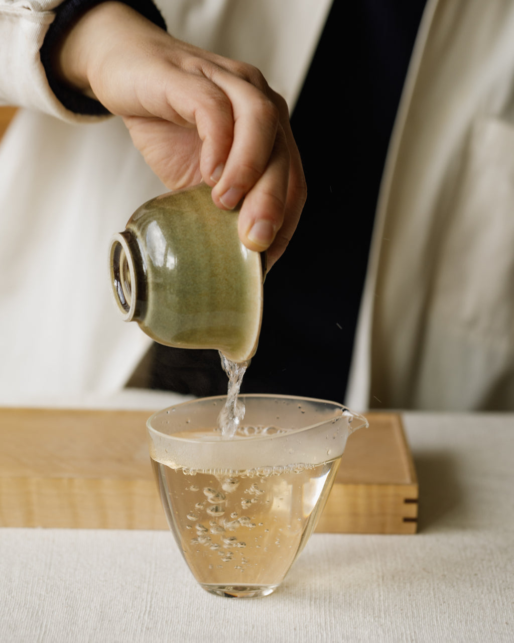 Brewed Jasmine Silver Tips poured from gaiwan into a cup
