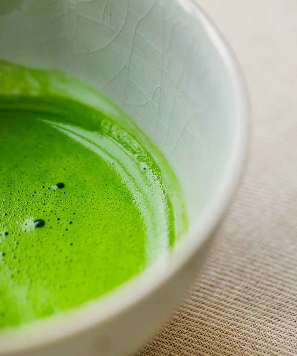 Top-down view of whisked Kirari usucha showing electric lime green color