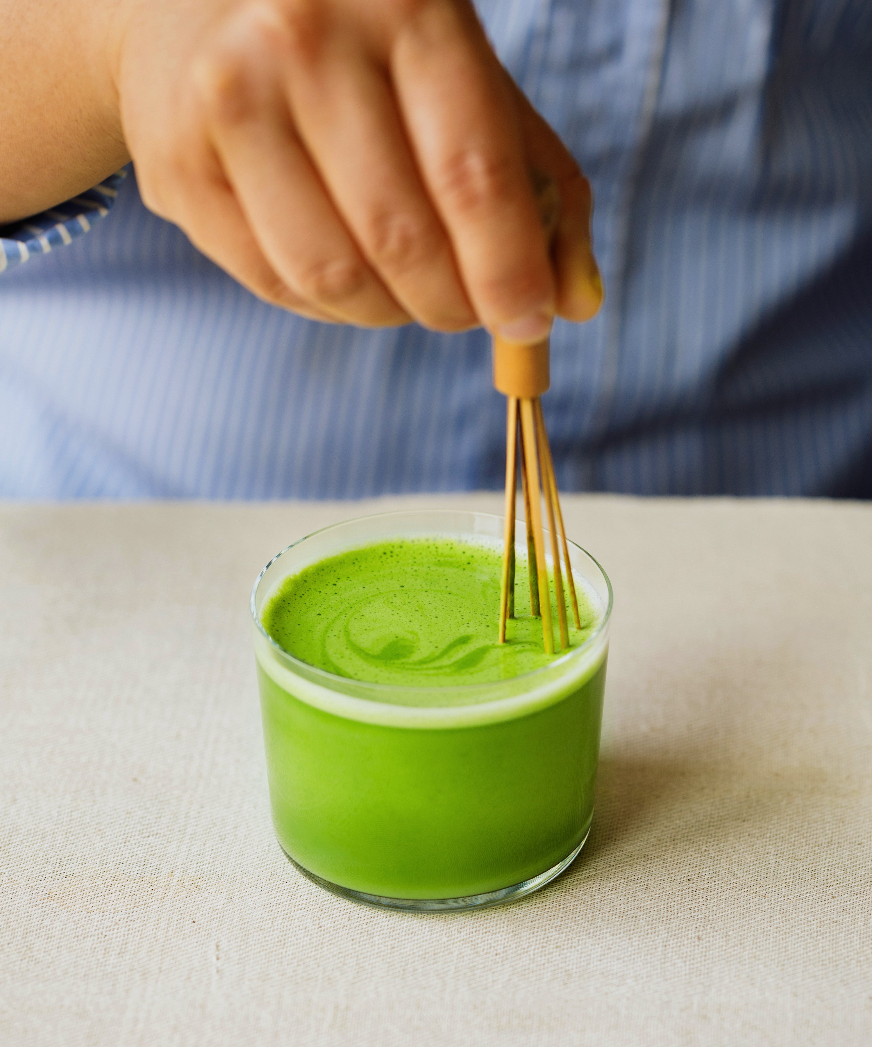 Top-down view of Kirari matcha latte showing layered lime green color