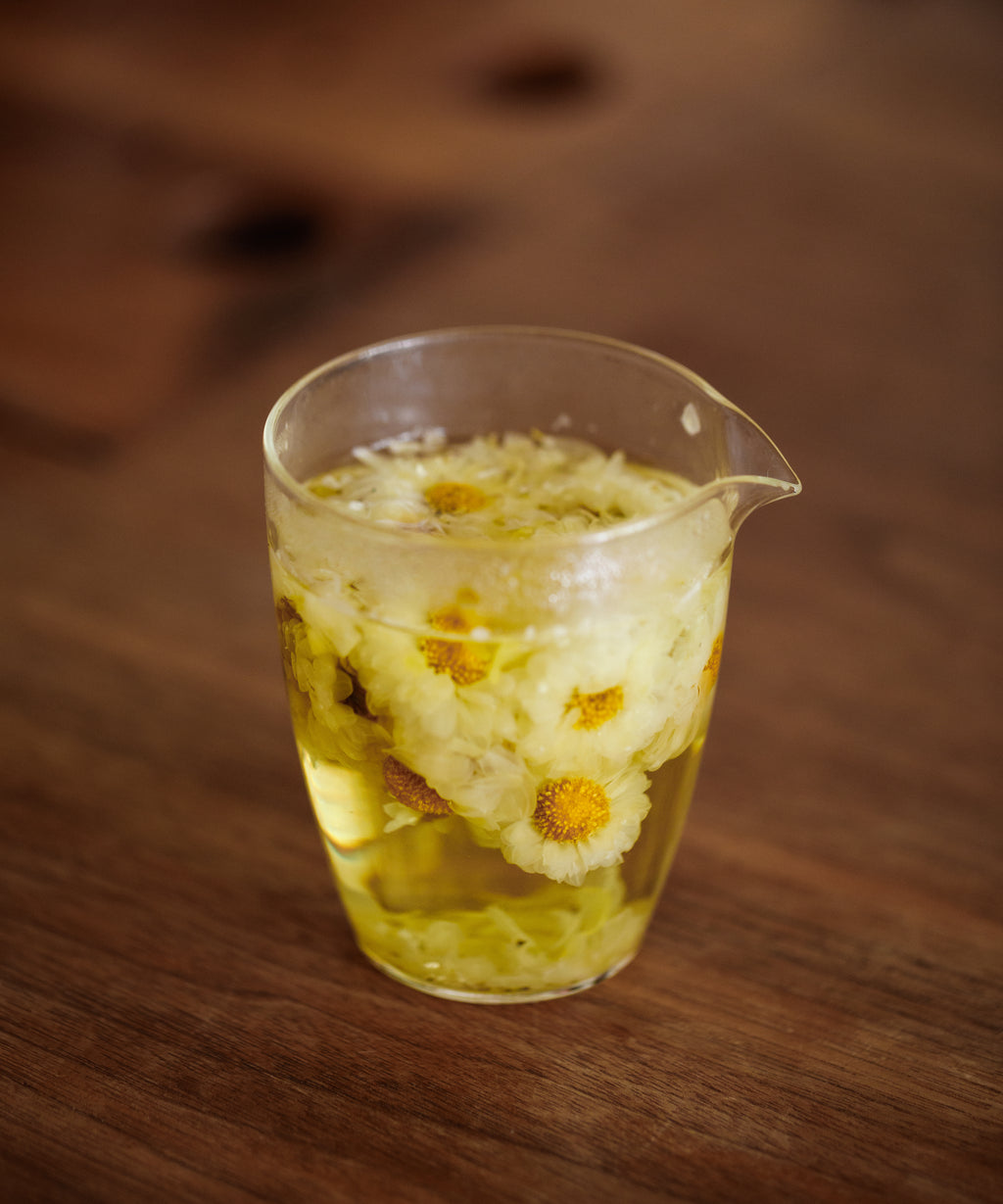 Silk Chrysanthemum Cake soft yellow liquor with flowery citrus notes of yuzu and bergamot