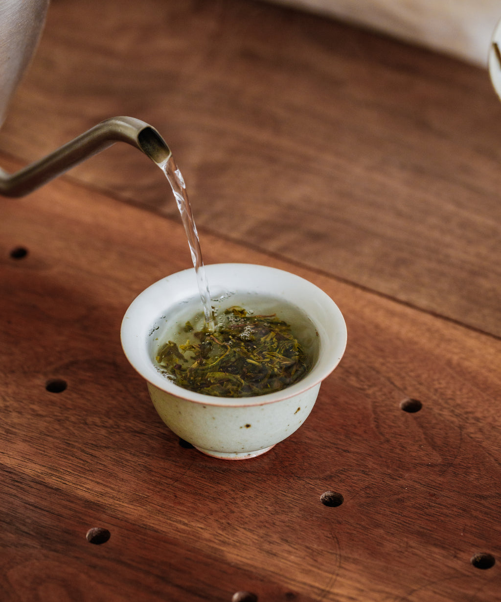 Jiutaipo Ancient Tree pu'erh brewed liquor — metallic, volcanic terrain notes with deep spreading energy