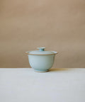 Gaiwan Celadon Ice, handcrafted gaiwan by Wang Xinghua, Jingdezhen, slick frozen-lake glaze with crackle veins