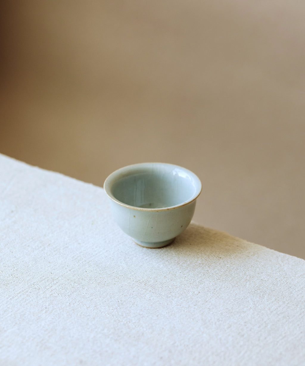 Cup Celadon Ice in hand, cool shiny celadon surface, Wang Xinghua gongfu teaware, Jingdezhen
