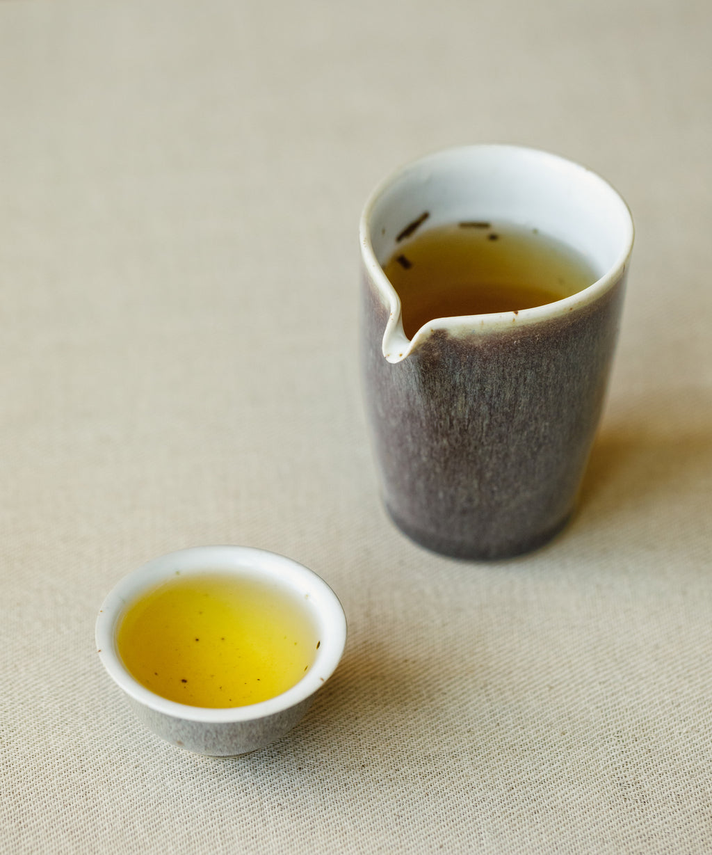 Brewed Noma Hojicha Shizu 7132 showing golden liquor with sakura finish